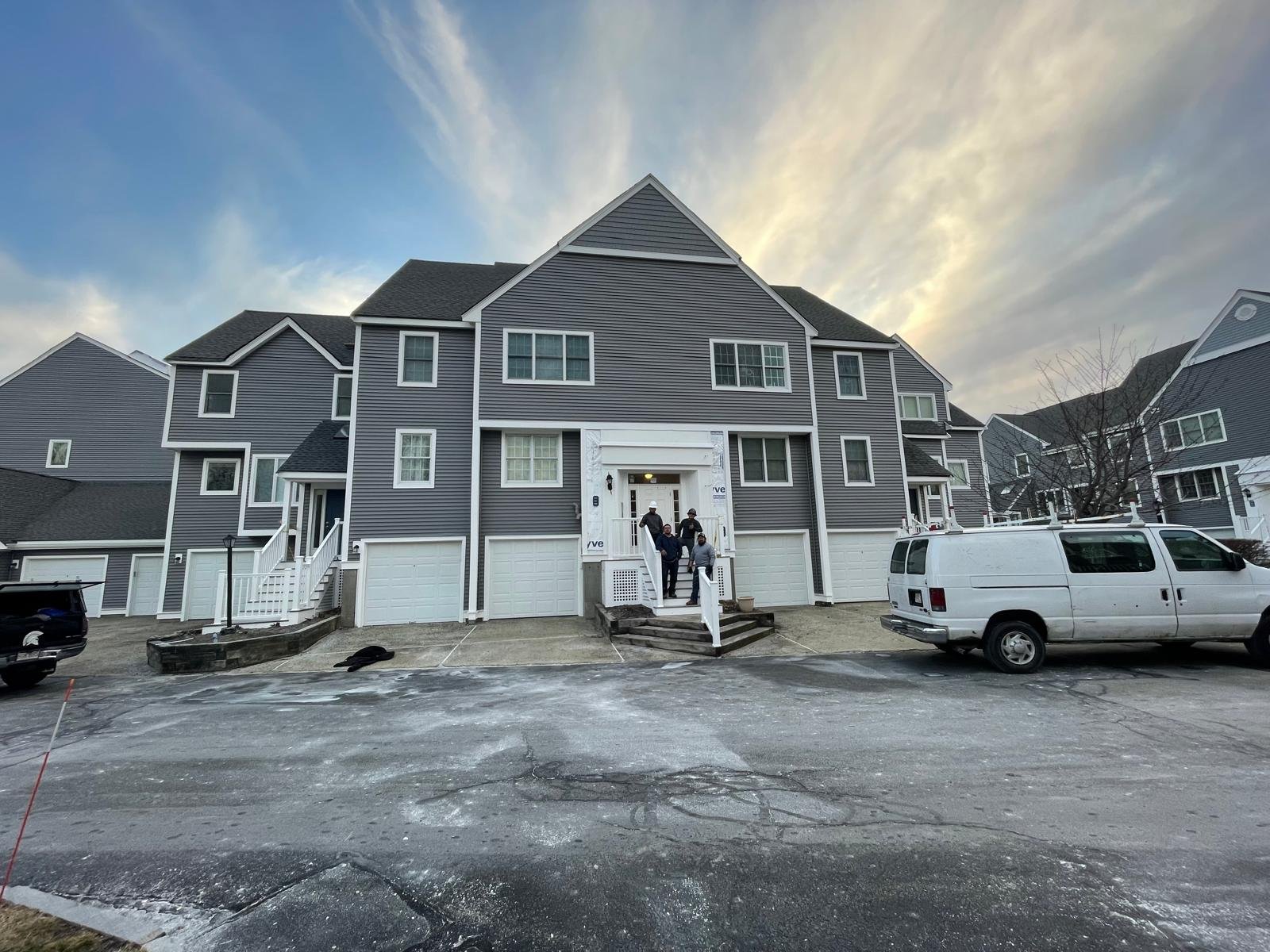 Servencios crew in front of a completed siding project